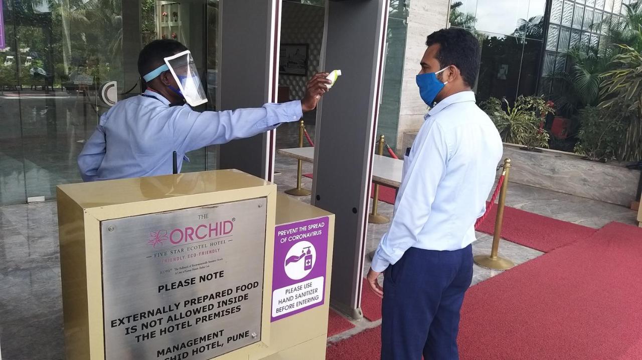 The Orchid Hotel Hinjewadi Pune Ngoại thất bức ảnh Temperature check at the entrance of a hotel in India